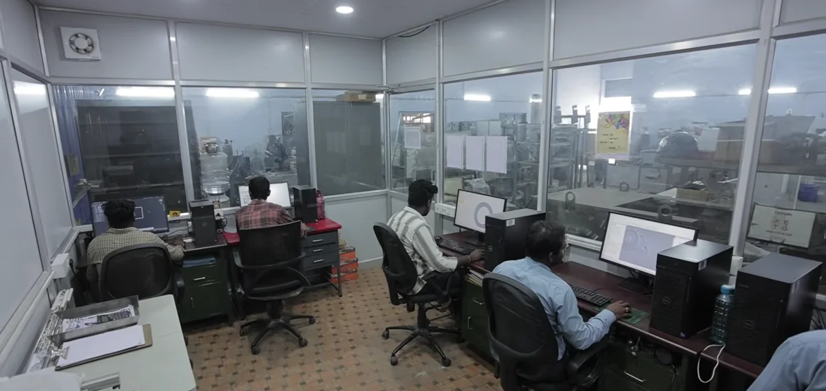 The engineering team working on machine designs
