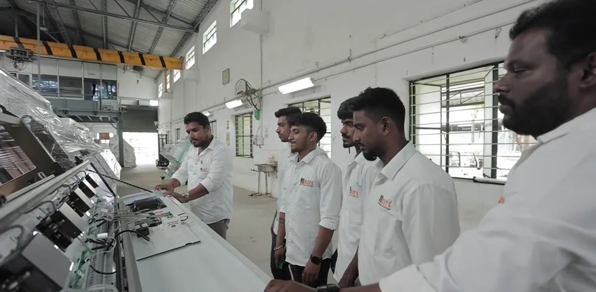 The MARK team inspecting a machine